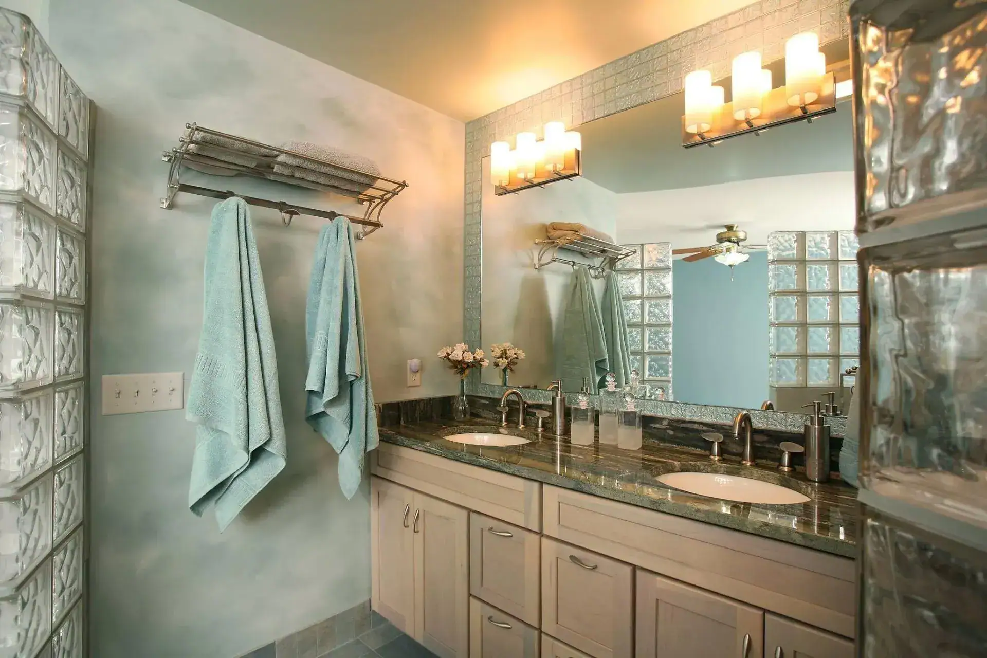 Contemporary bathroom with double sink vanity and large mirror.