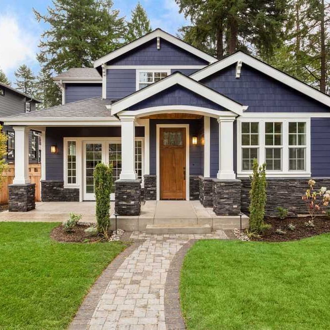 craftsman-home-navy-blue-lap-siding-stone-veneer-exterior-design-madison-wi