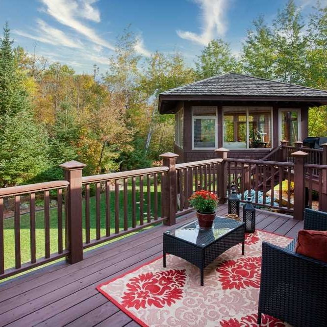 custom-multi-level-wood-deck-railing-outdoor-living-space-arrow-exterior-design-madison-wi